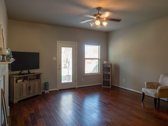 sitting room featuring ceiling fan and dark hardwood / wood-style flooring