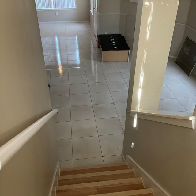 staircase with tile patterned flooring