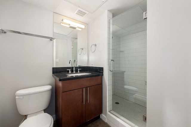 bathroom with vanity, toilet, and walk in shower