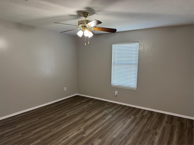 unfurnished room with a textured ceiling, ceiling fan, and dark wood-type flooring