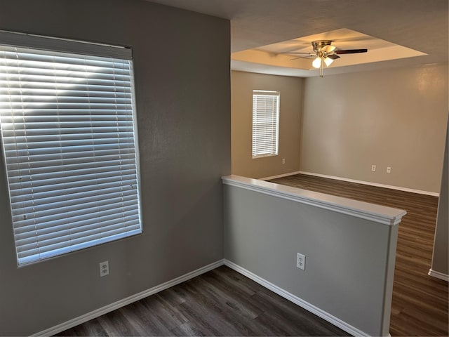 spare room featuring ceiling fan and dark hardwood / wood-style flooring