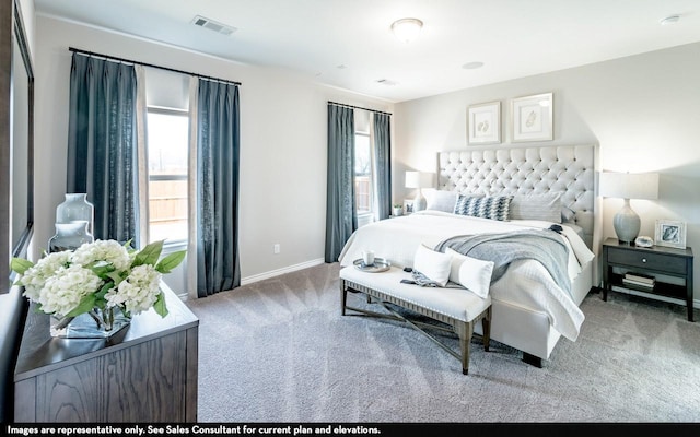 bedroom featuring carpet flooring and multiple windows