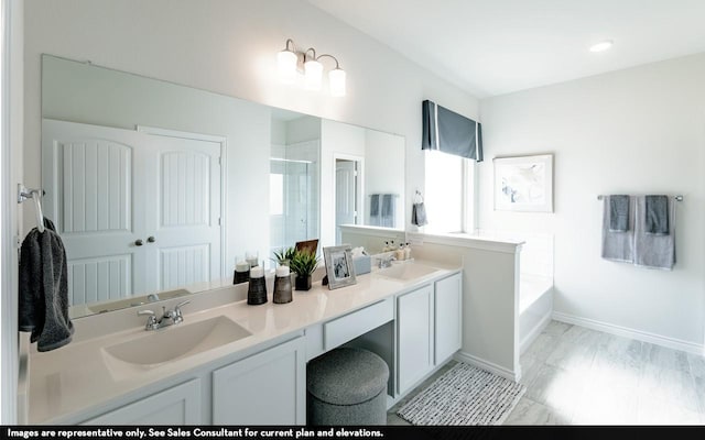 bathroom featuring vanity and shower with separate bathtub