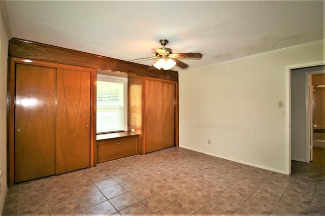 unfurnished bedroom with a textured ceiling, ceiling fan, and crown molding