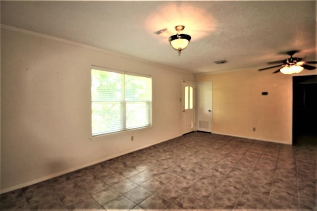 empty room with ceiling fan and ornamental molding