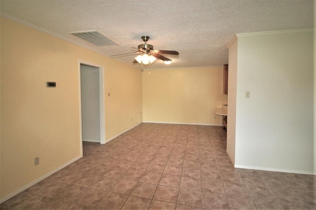 unfurnished room featuring a textured ceiling, ceiling fan, and crown molding