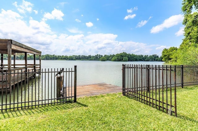 dock area featuring a yard and a water view