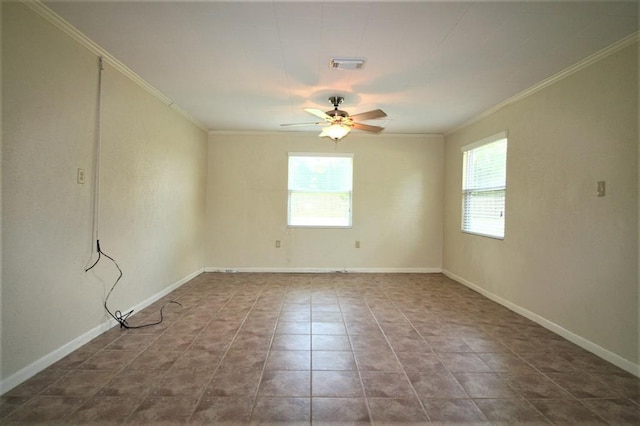 spare room featuring tile patterned flooring, plenty of natural light, ceiling fan, and crown molding