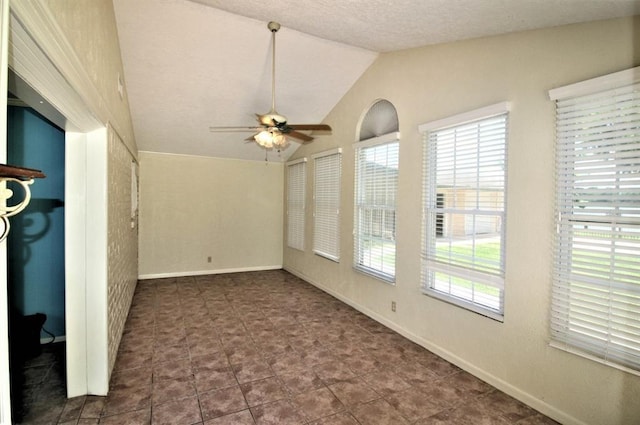 interior space with ceiling fan and lofted ceiling