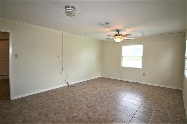 spare room with ceiling fan and ornamental molding