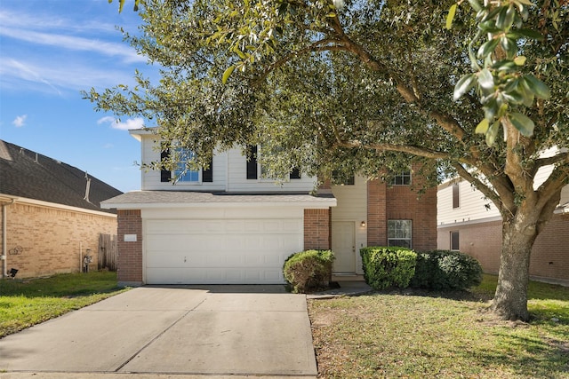 view of front of home with a front yard and a garage