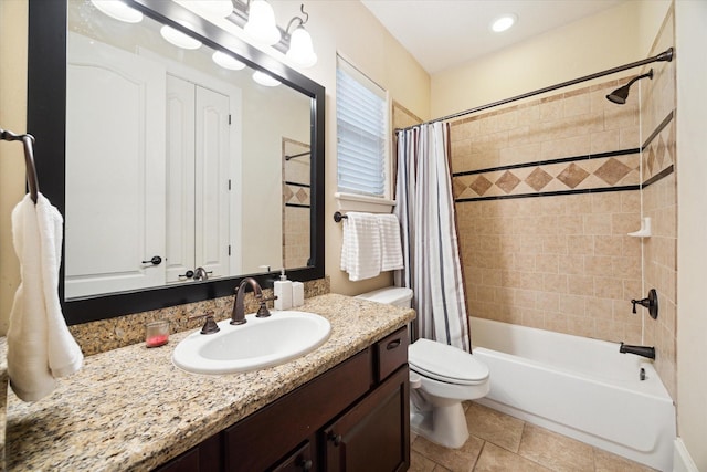 full bathroom featuring tile patterned floors, vanity, shower / bathtub combination with curtain, and toilet