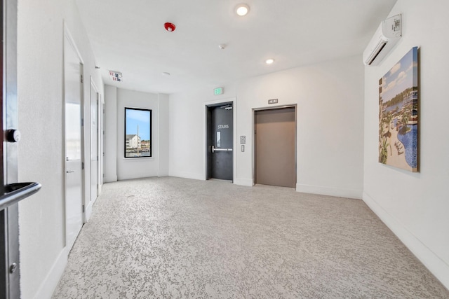 interior space featuring an AC wall unit and elevator