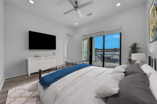 bedroom with access to outside, ceiling fan, and hardwood / wood-style flooring