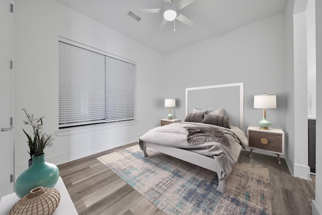 bedroom featuring a closet, hardwood / wood-style flooring, and ceiling fan