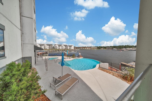 view of swimming pool with a patio area