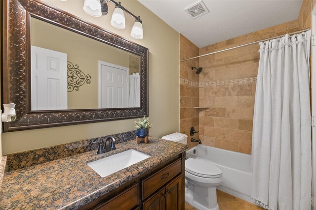 full bathroom featuring vanity, shower / bathtub combination with curtain, and toilet