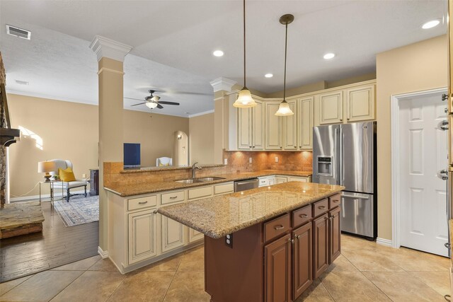 kitchen featuring ornate columns, stainless steel appliances, ceiling fan, sink, and light tile patterned floors