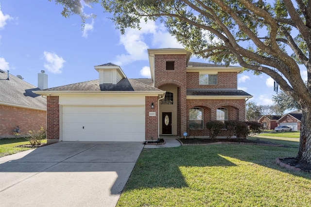 view of front of house with a front yard and a garage