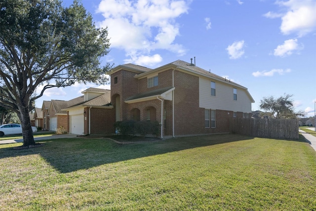 exterior space with a lawn and a garage