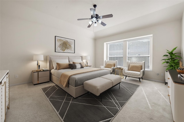 bedroom with light carpet and ceiling fan