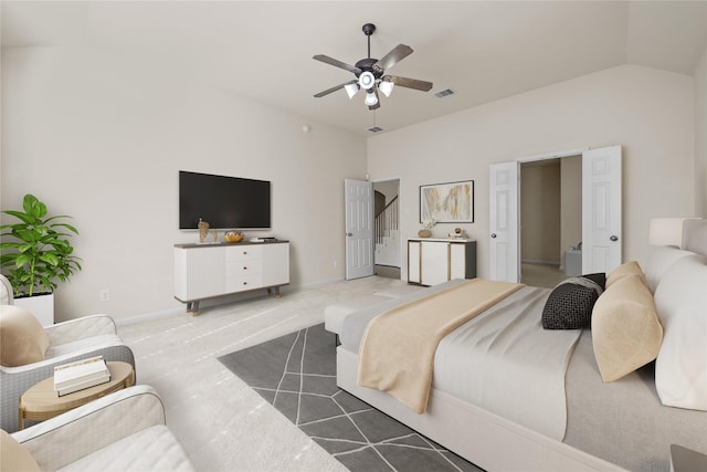 bedroom featuring ceiling fan, lofted ceiling, and light carpet