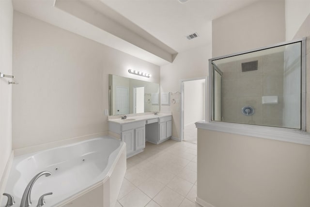 bathroom featuring independent shower and bath, tile patterned floors, and vanity