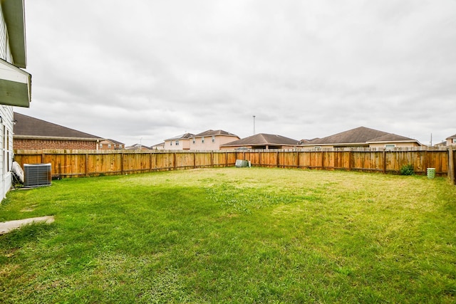 view of yard featuring central AC unit