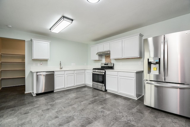 kitchen featuring white cabinets, appliances with stainless steel finishes, and sink