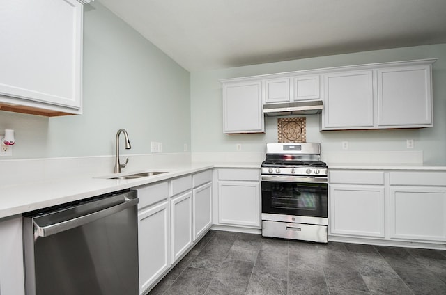 kitchen with stainless steel appliances, white cabinetry, and sink