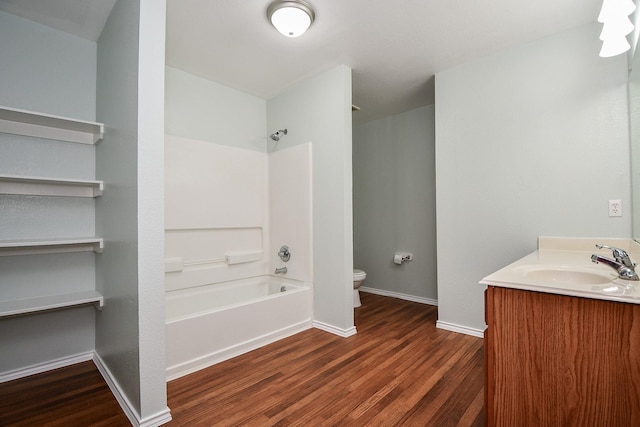 full bathroom featuring shower / tub combination, vanity, wood-type flooring, and toilet