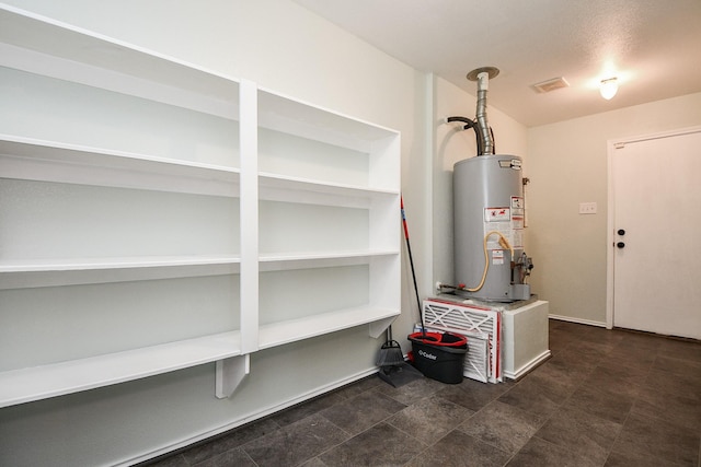 utility room with water heater