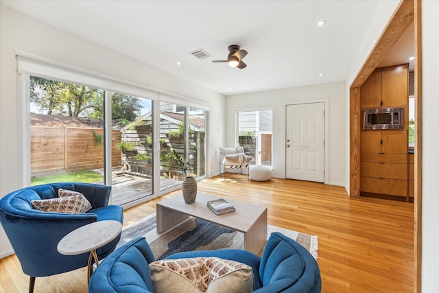 living room with light hardwood / wood-style floors