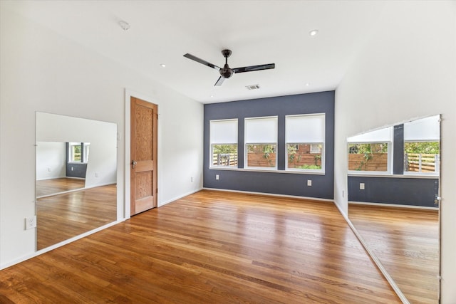 interior space with ceiling fan and hardwood / wood-style flooring