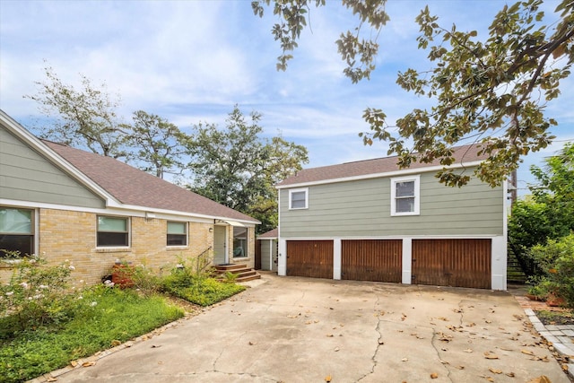 view of side of home with a garage