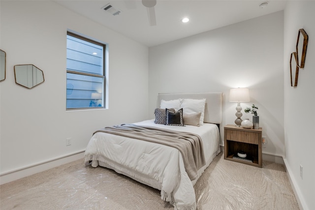 bedroom with ceiling fan and light colored carpet