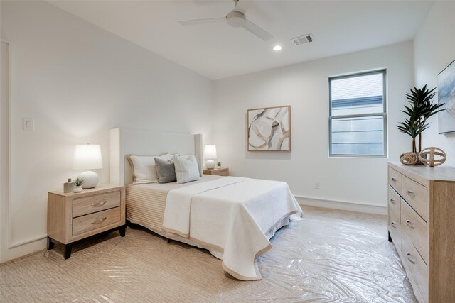 bedroom with light carpet and ceiling fan