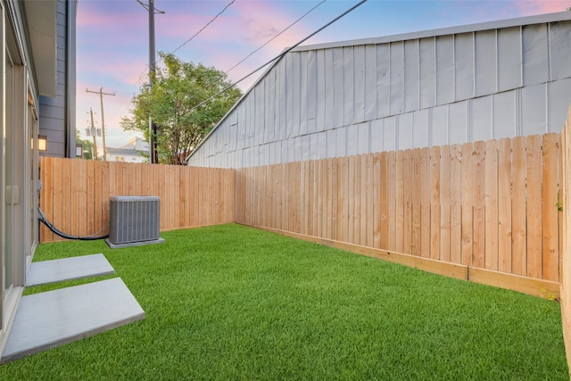 yard at dusk with cooling unit