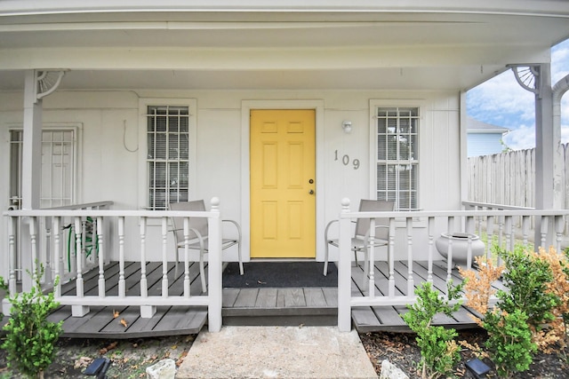 property entrance with covered porch