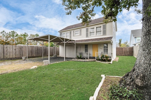 back of property featuring a yard, a porch, and a carport