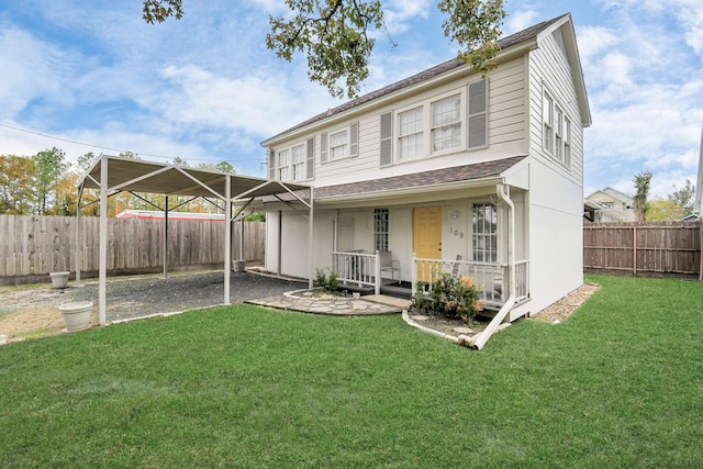 view of front of house with a front yard, a porch, and a carport