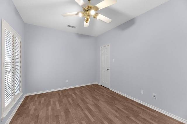 unfurnished room featuring hardwood / wood-style flooring and ceiling fan