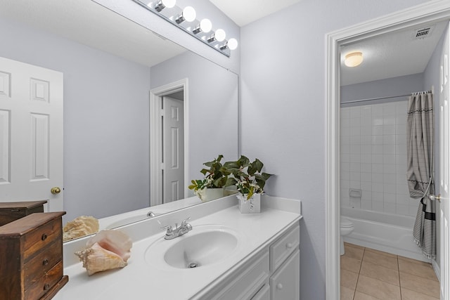 full bathroom with toilet, vanity, tile patterned floors, and shower / tub combo with curtain