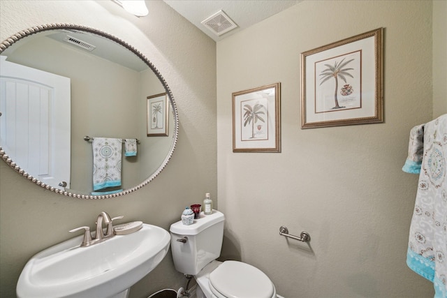 bathroom featuring sink and toilet