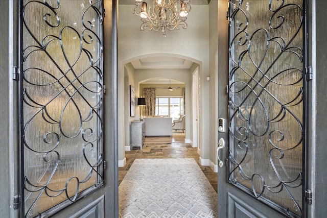 foyer entrance with a notable chandelier