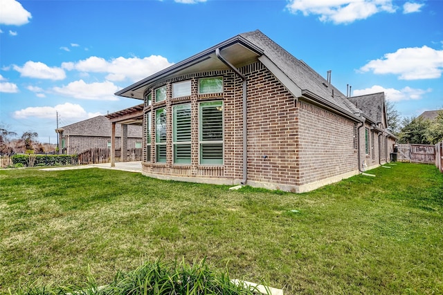 view of property exterior with a yard