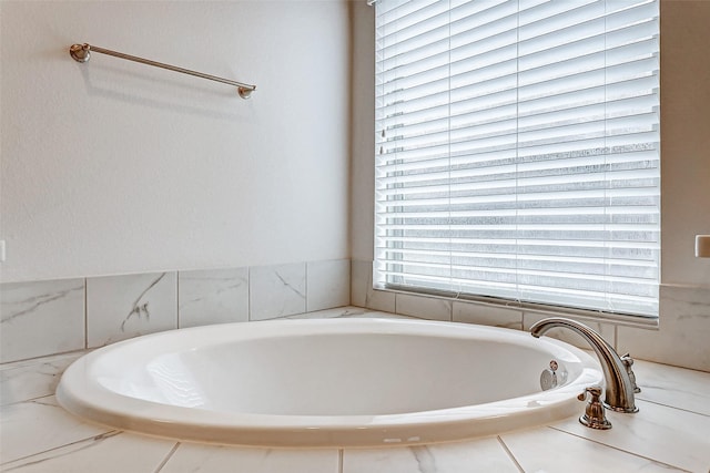 bathroom featuring a relaxing tiled tub