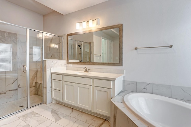 bathroom featuring vanity and shower with separate bathtub