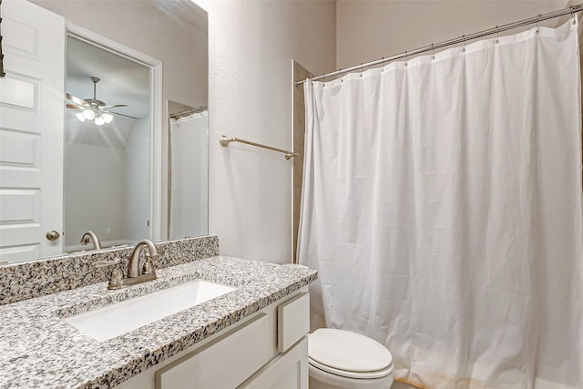 bathroom featuring ceiling fan, vanity, and toilet