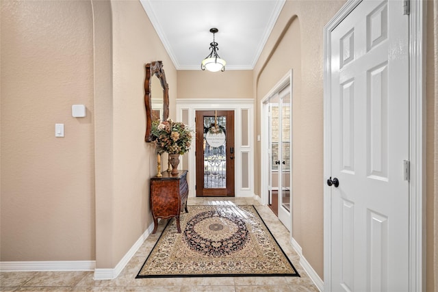 foyer with ornamental molding and light tile patterned floors